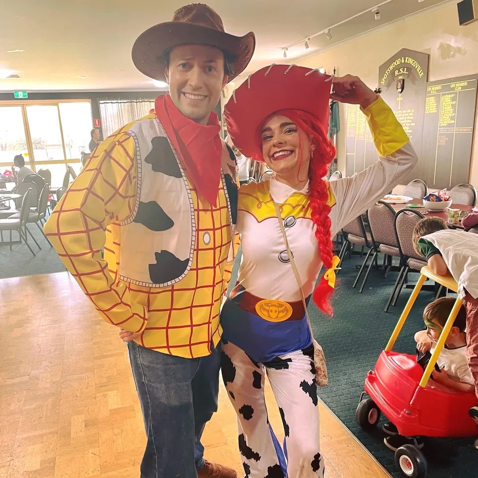 Toy Story Woody and Jessie cowboy party entertainers in matching costumes posing together at a Melbourne Toy Story themed kids birthday party in a community hall